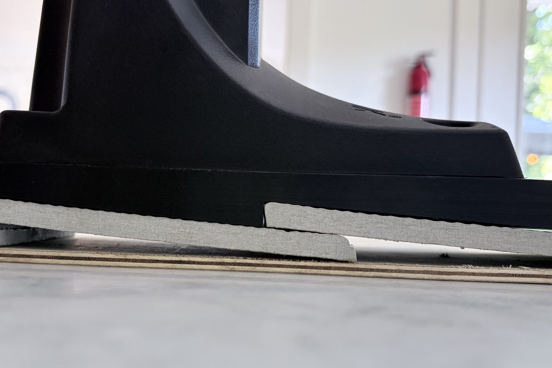 Hoselink bracket on a MilliMount plate over lap siding, sitting flush across the step