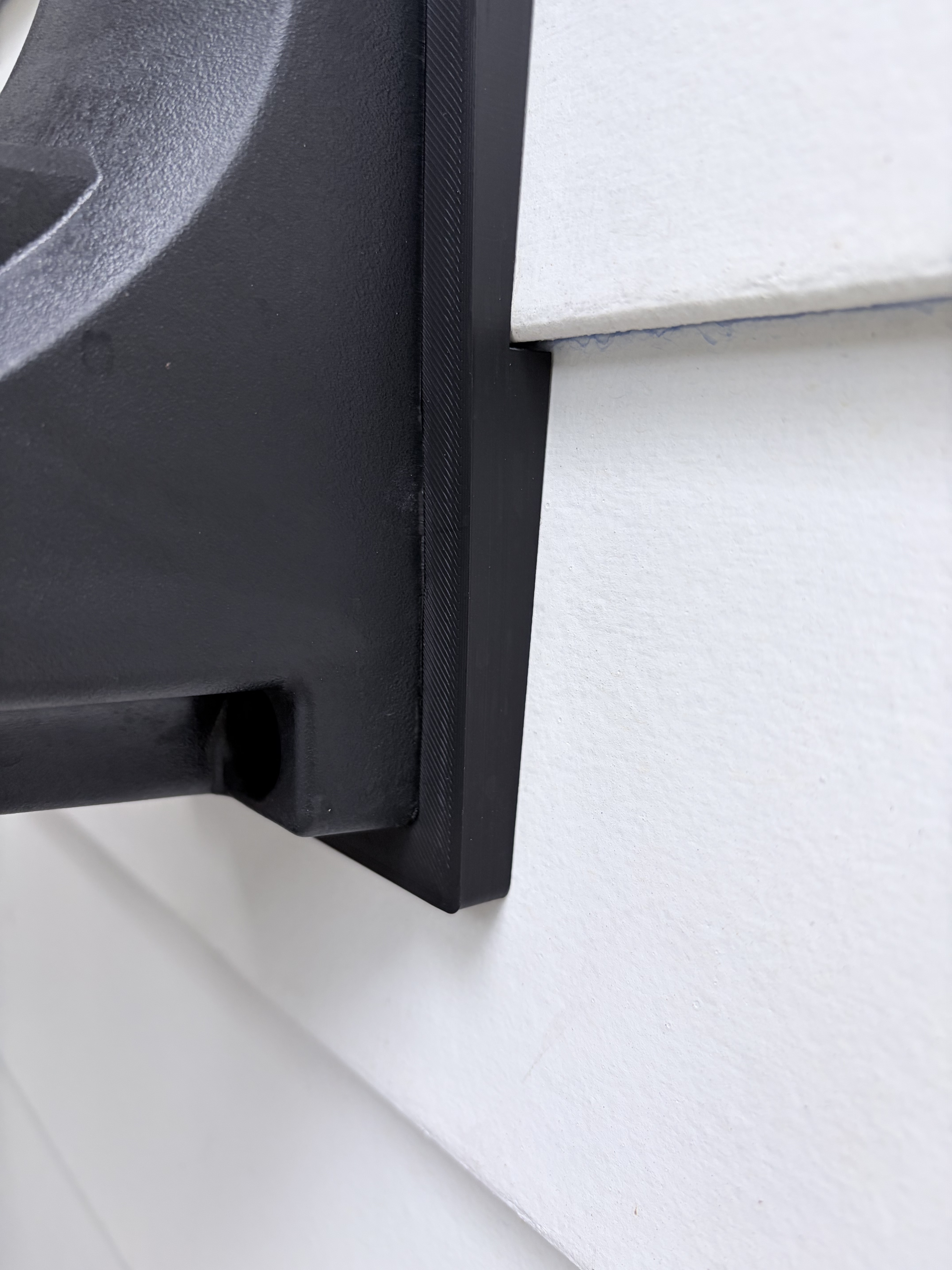 The bracket following the siding step, edge-on